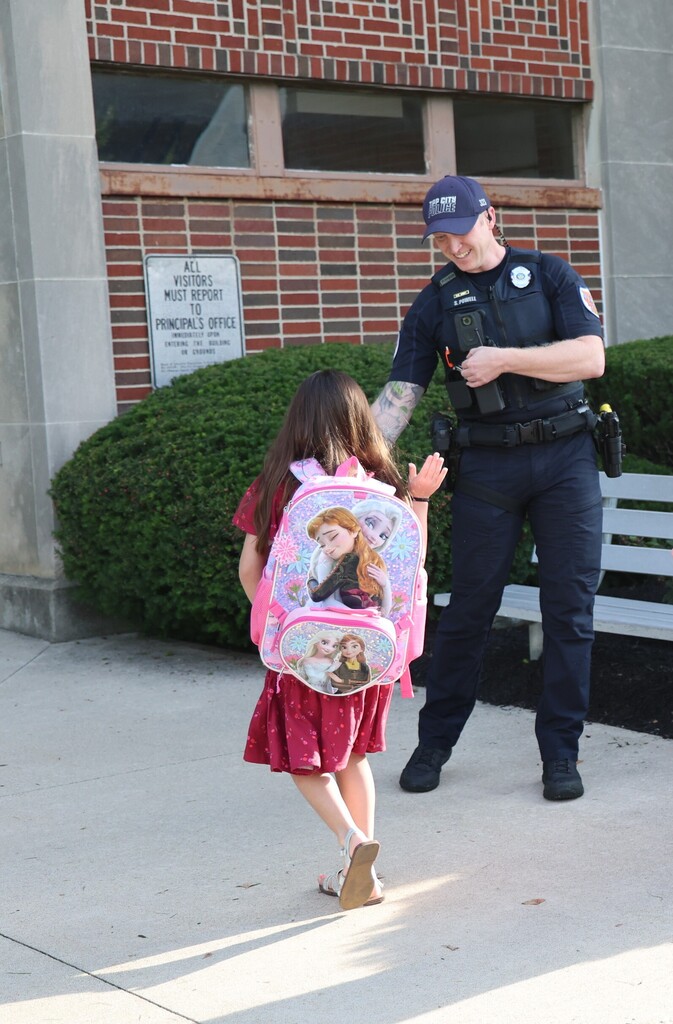 Tipp City Fire, EMS, and Police greet students on the first day of school with fist bumps, hi fives, smiles, and encouragement. 