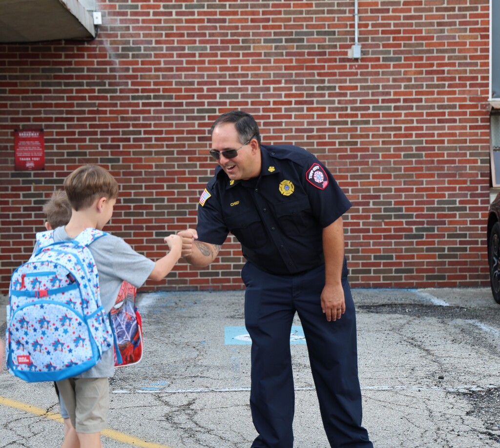 Tipp City Fire, EMS, and Police greet students on the first day of school with fist bumps, hi fives, smiles, and encouragement. 