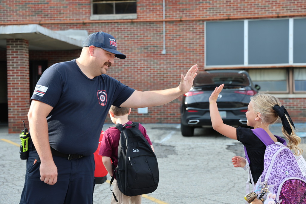 Tipp City Fire, EMS, and Police greet students on the first day of school with fist bumps, hi fives, smiles, and encouragement. 