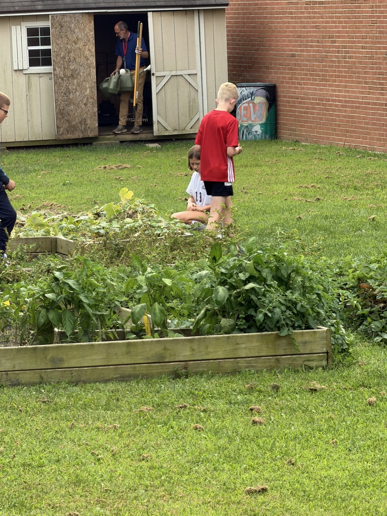 TMS Garden Club inspects the garden. 