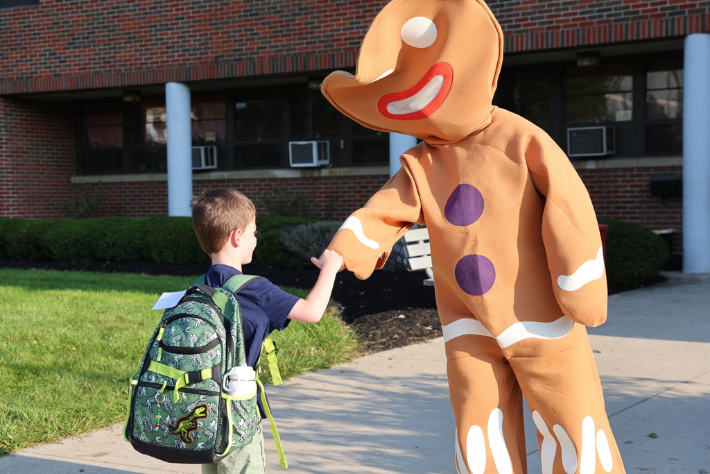 Gingerbread man interacts with a Broadway student.
