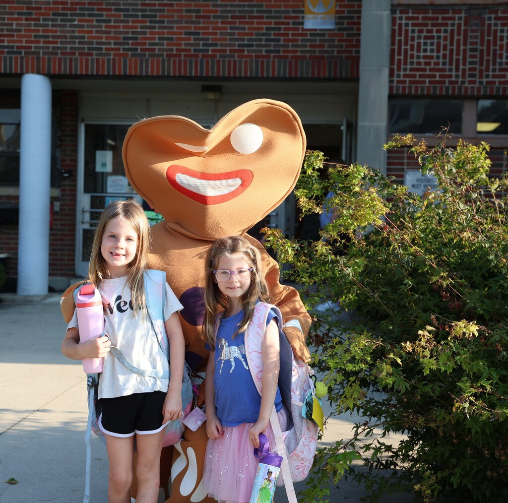 Gingerbread man interacts with 2 Broadway students.