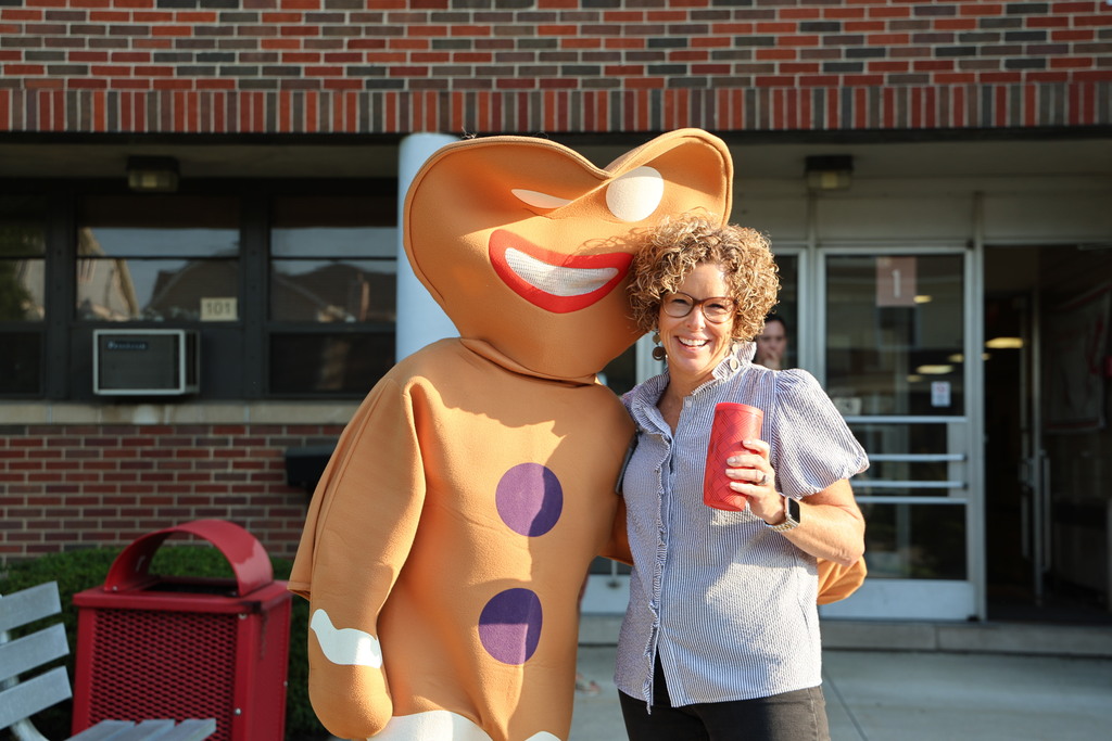 Gingerbread man interacts with the Broadway principal.  