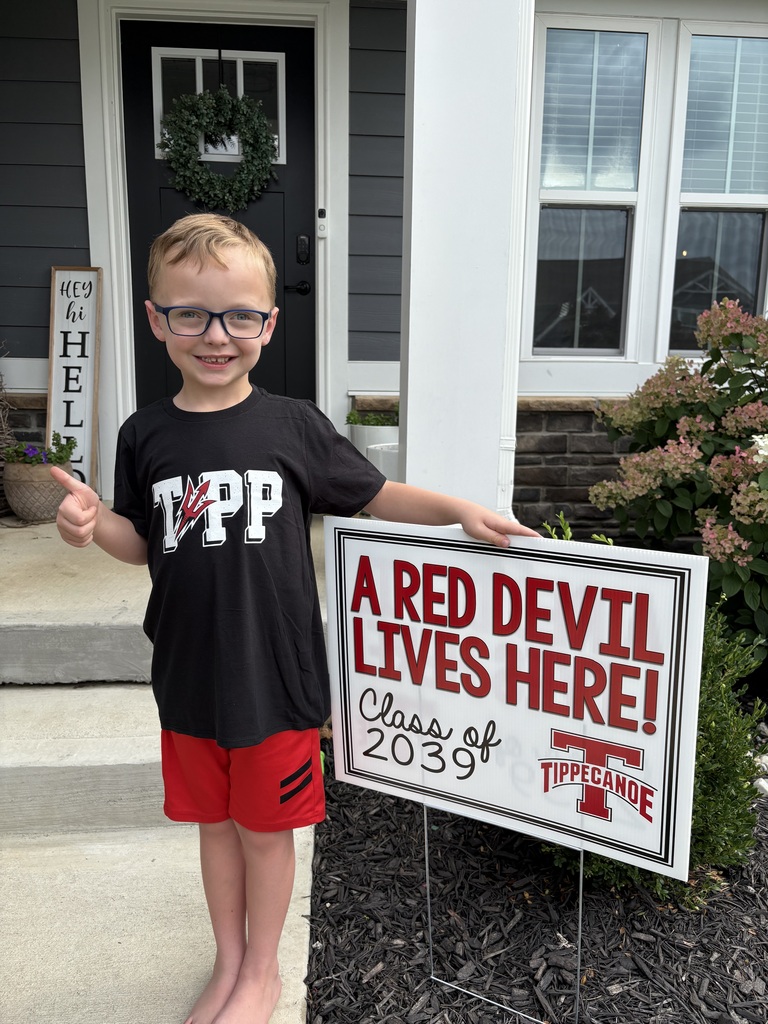 A cute little Red Devil with his sign.