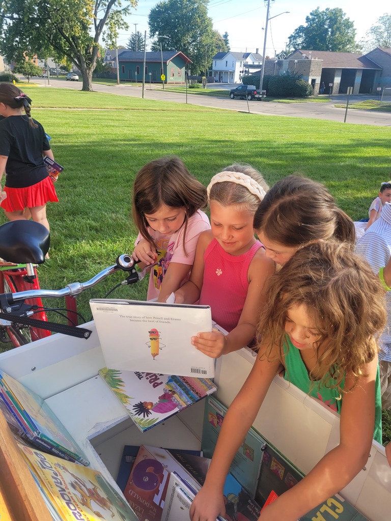 Broadway Elementary students picking out books.