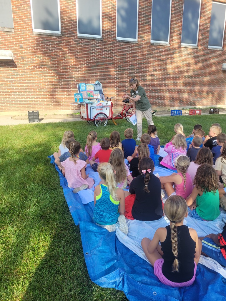 Miss Wendy from the Tipp City Public Library talks with first graders.