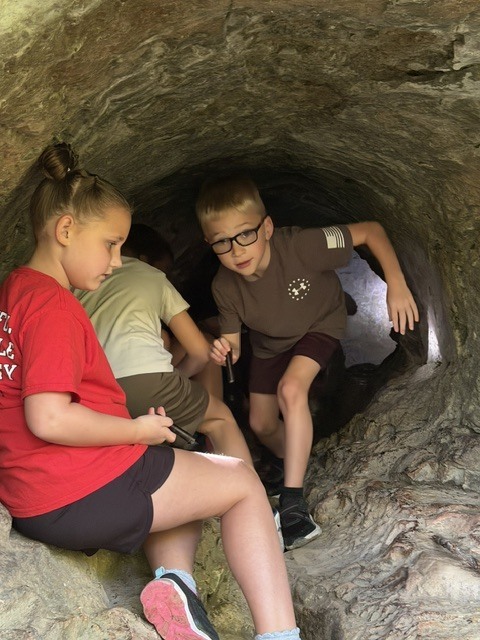 Second graders at Charleston Falls.   They are in a cave.