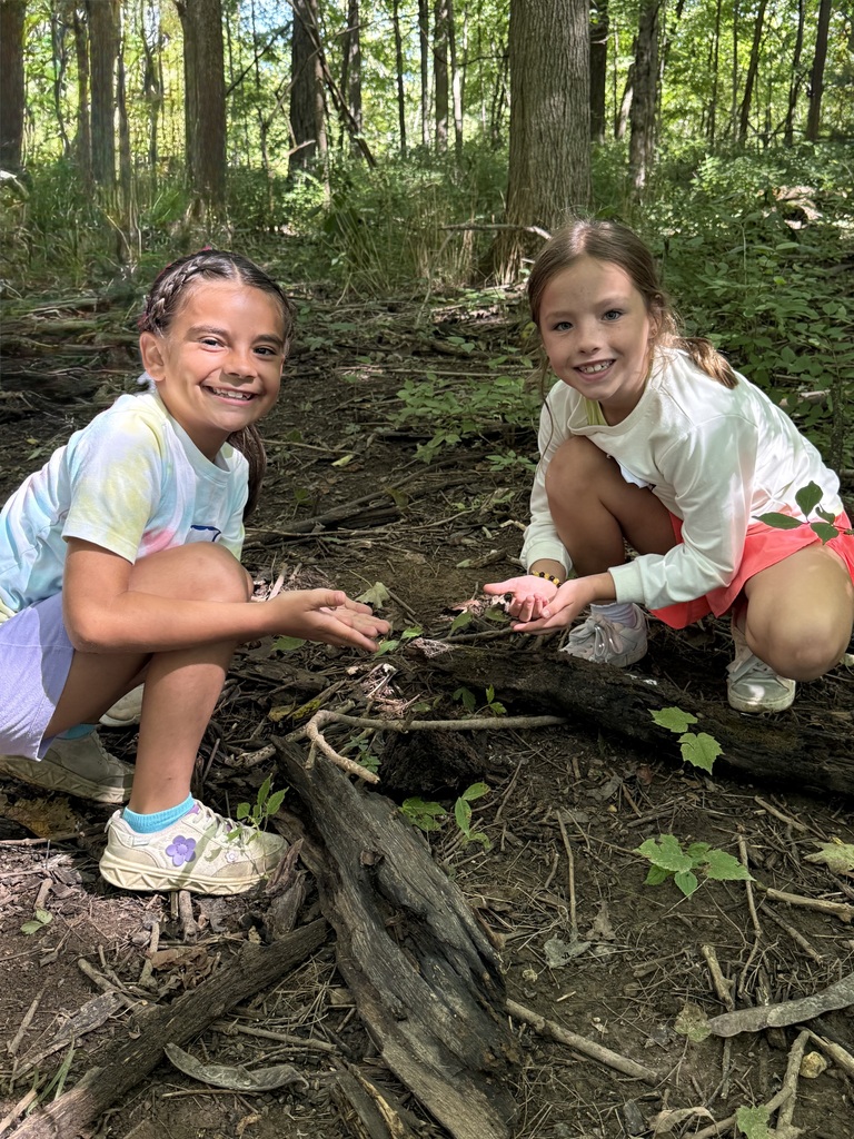 Second graders at Charleston Falls.  Here two students explore the earth.
