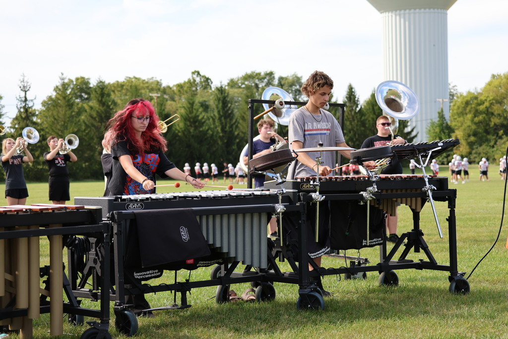 THS Marching Band practices after school with their instruments and movements.