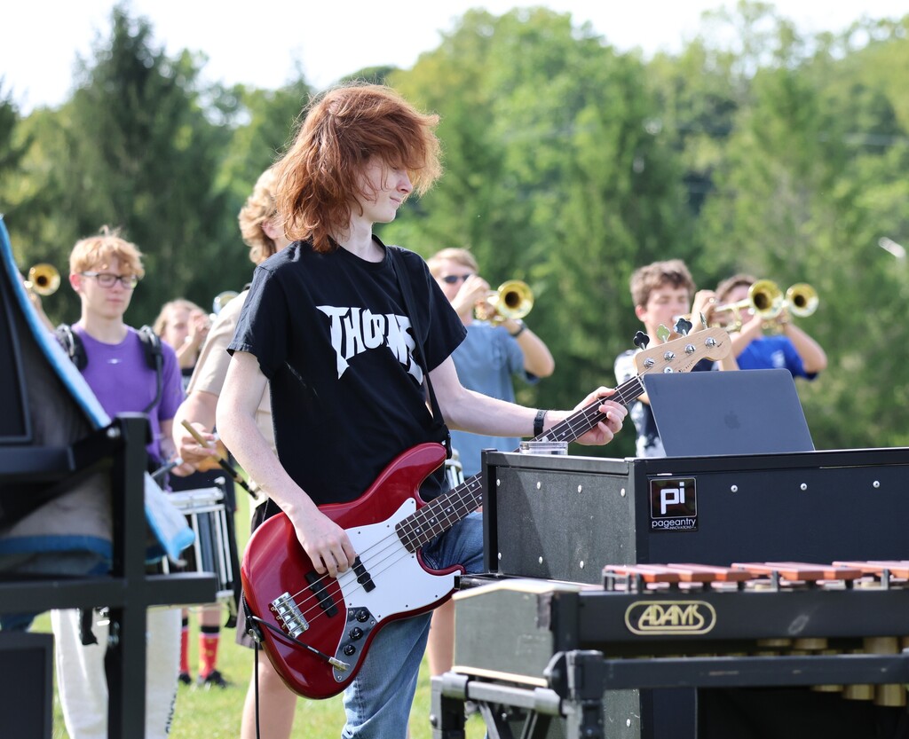 THS Marching Band practices after school with their instruments and movements.