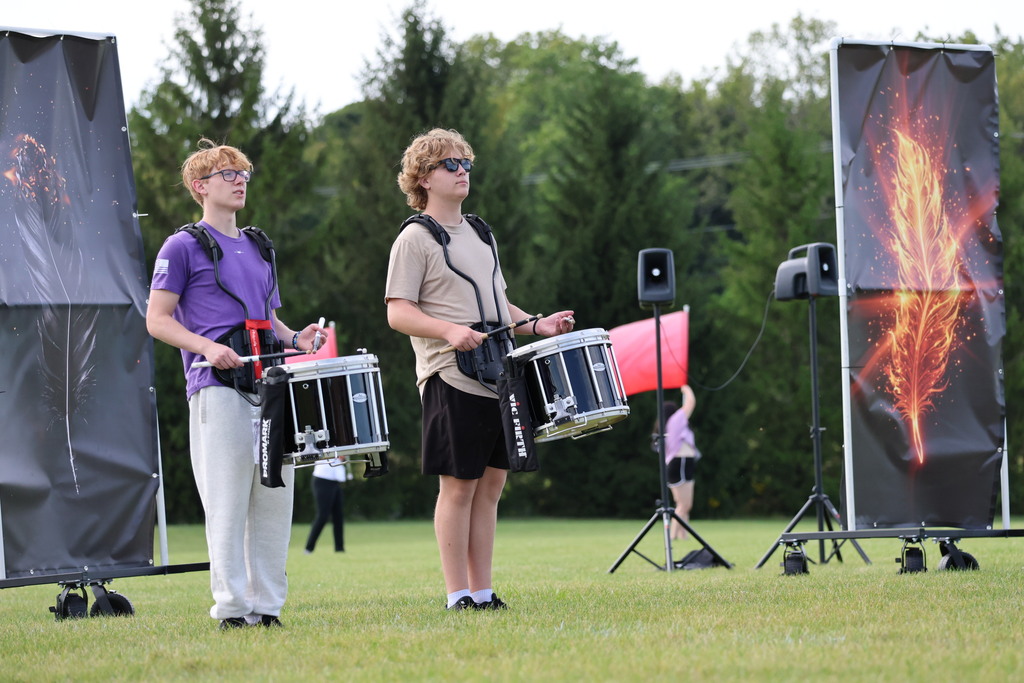 THS Marching Band practices after school with their instruments and movements.
