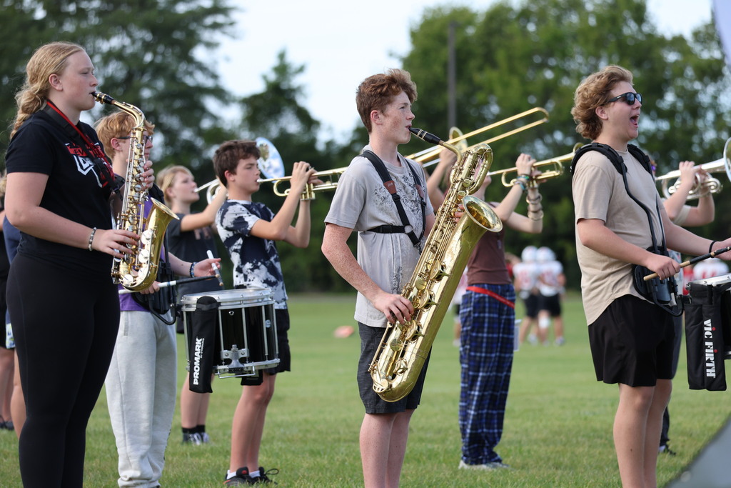 THS Marching Band practices after school with their instruments and movements.