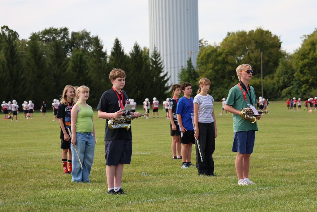THS Marching Band practices after school with their instruments and movements.