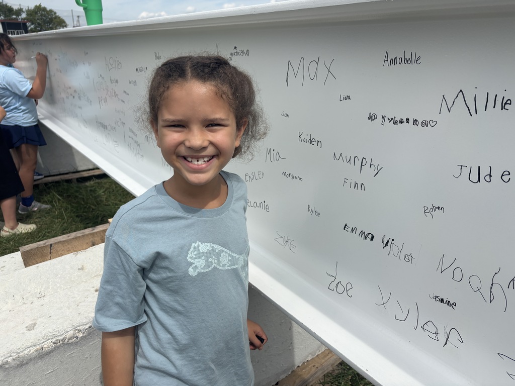 L.T. Ball student gets ready to sign the steel beam that will go in the new school. 