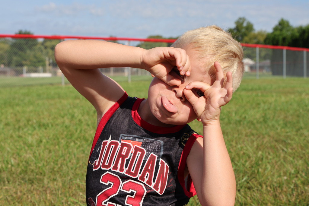 Broadway student gets a little silly for the camera while waiting for the school bus after signing the beam. 