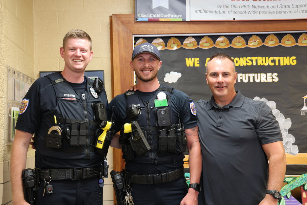 Three members of the Tipp City Police Department at one of our schools before a scheduled safety drill.  