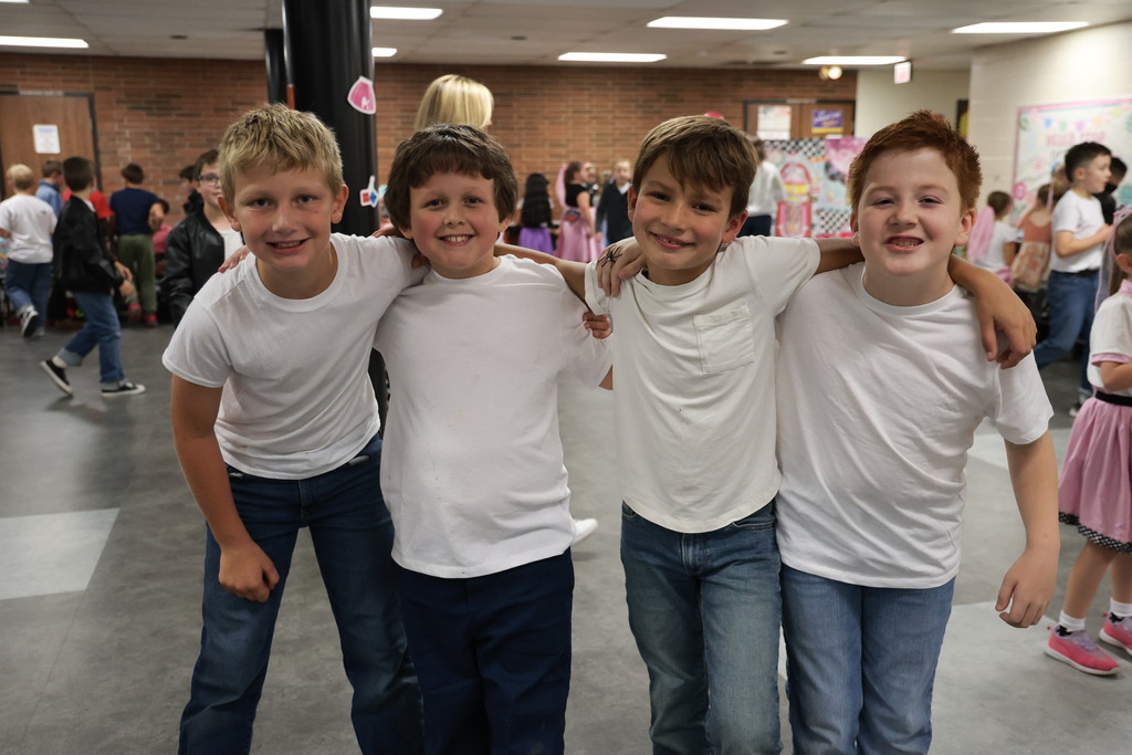 Third graders pose for a picture at the Sock Hop.