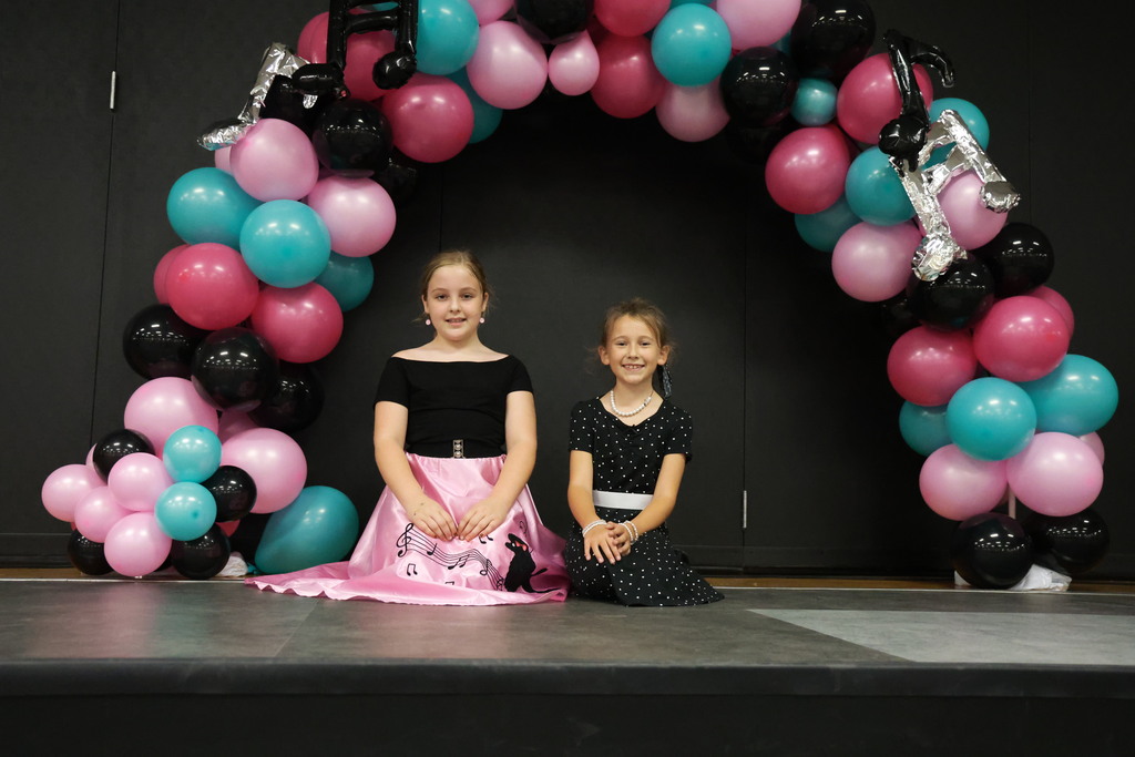 Third graders pose for a picture at the Sock Hop.
