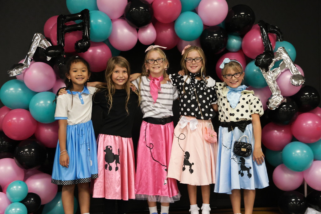 Third graders pose for a picture at the Sock Hop.