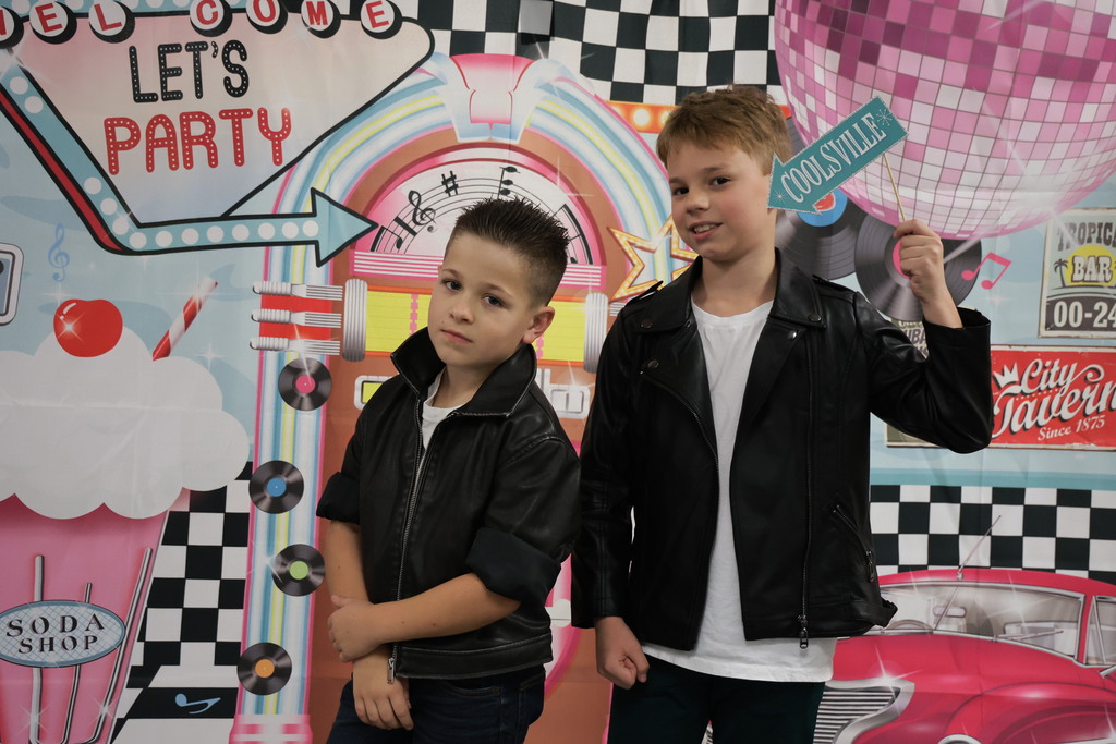 Third graders pose for a picture at the Sock Hop.