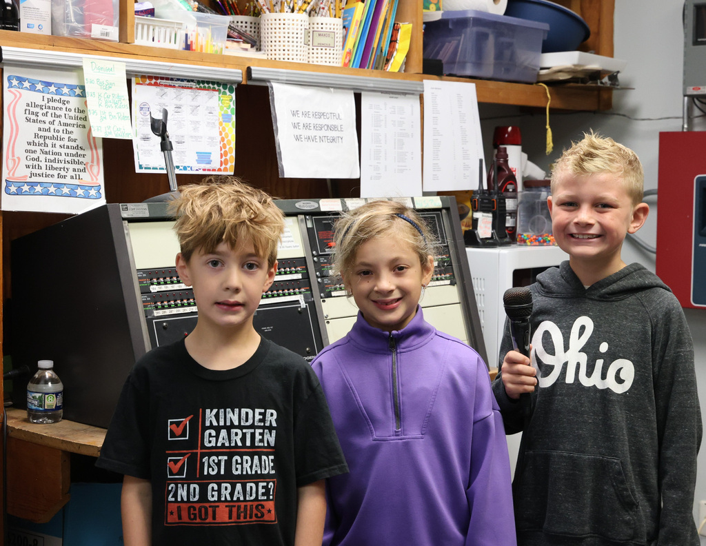 The three BW students who said the Pledge of Allegiance on a recent morning pose for a photo.