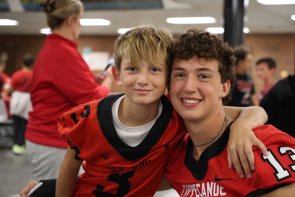 A THS football player with an L.T. Ball fan.