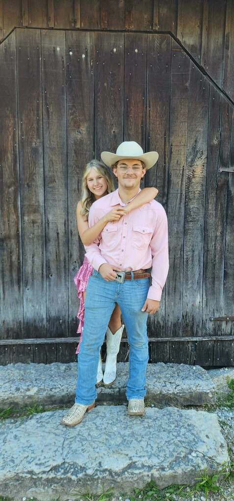 Two students pose for a photo before the Tippecanoe High School homecoming.