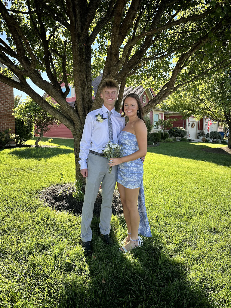 Two students pose for a photo dressed up for the Tippecanoe High School homecoming.
