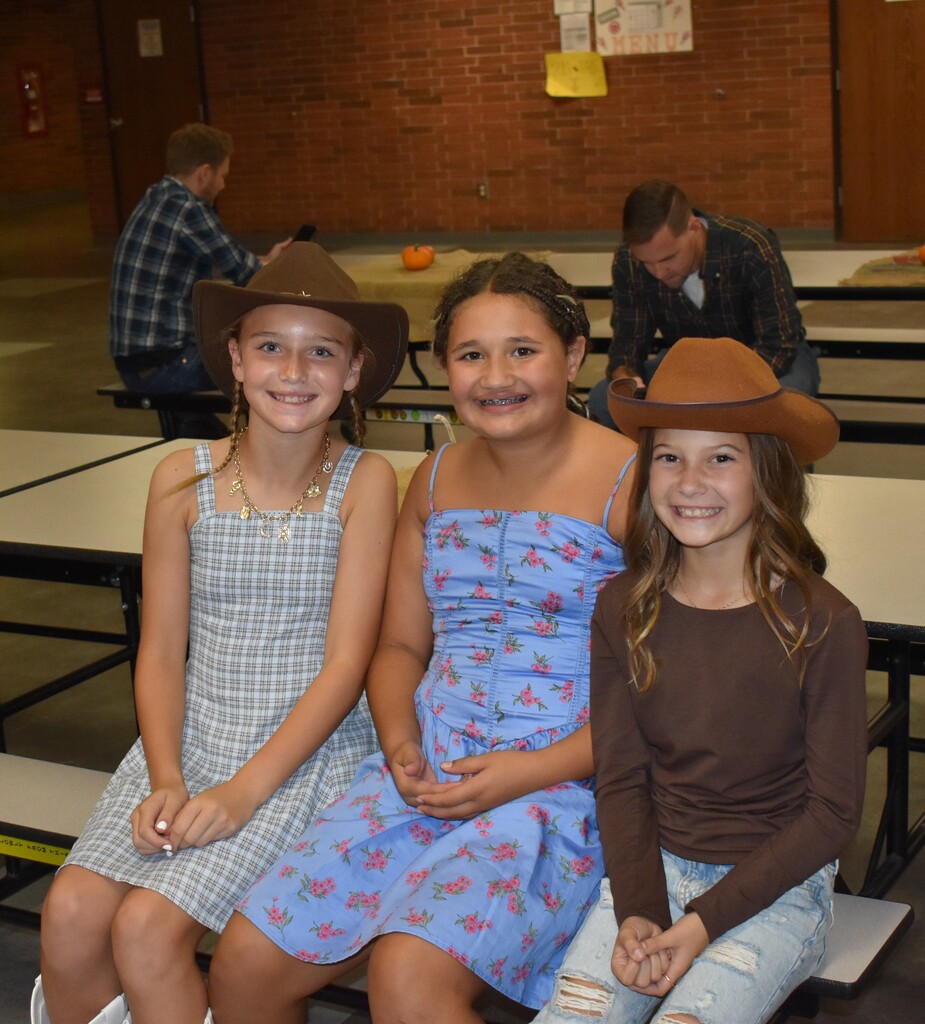 Three LT Ball students all dressed up in the cowgirl gear for the Hoe Down.  