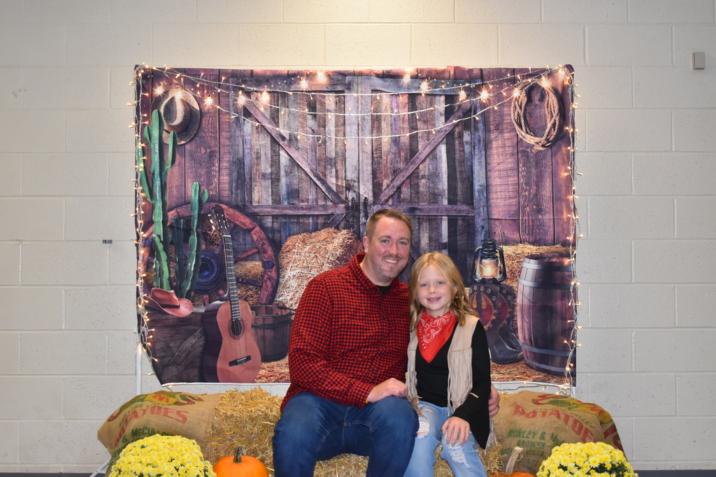 A father and his daughter at the Hoe Down.  