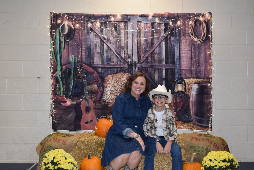 A mother and her son pose for a photo at the Hoe Down.  