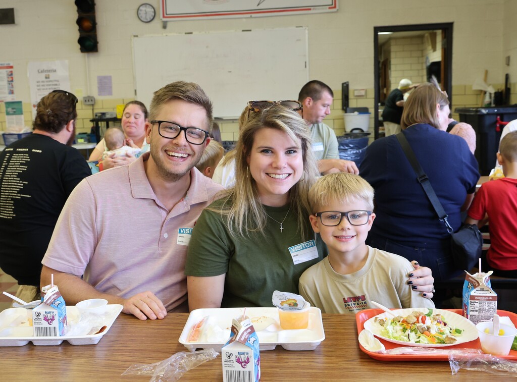 A mom, dad and their son enjoy lunch at Broadway during National School Lunch Week.