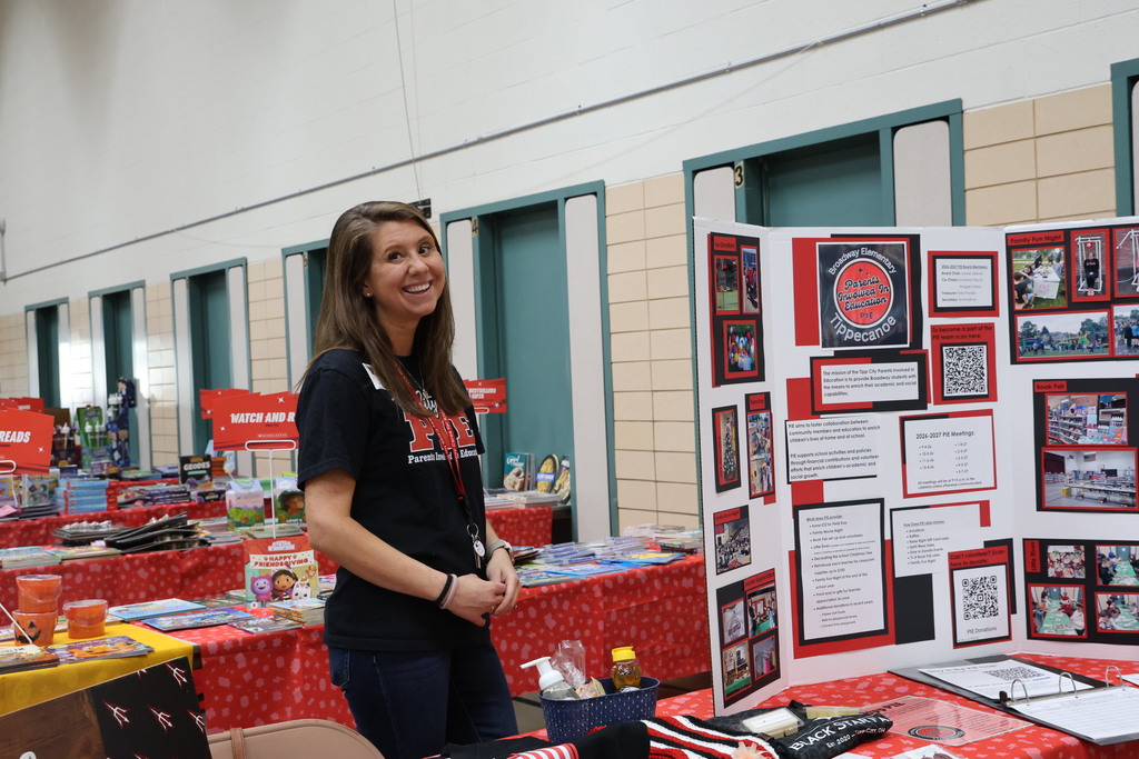 A parent volunteer is ready to greet families, introduce them to PIE, and offer raffle tickets.