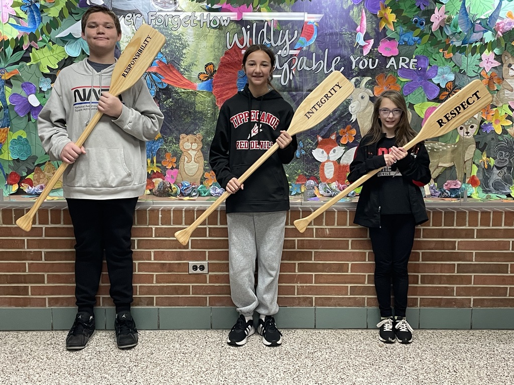 TMS Crew of the Week with the oars representing the PBIS pillars.