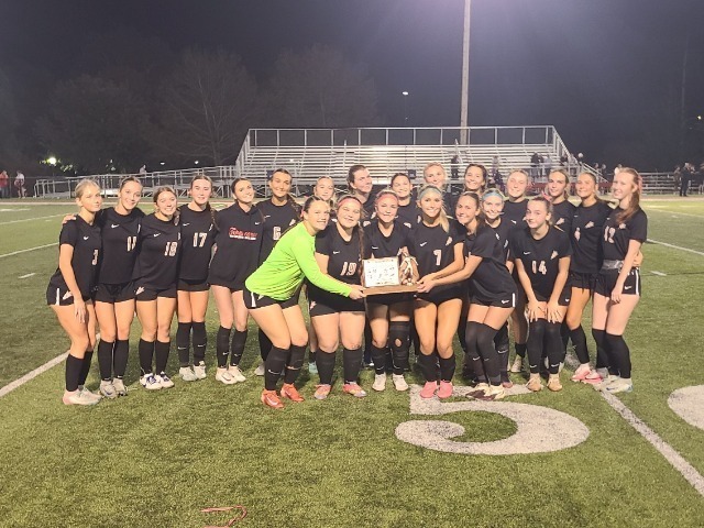 THS girls soccer with their MVL trophy.