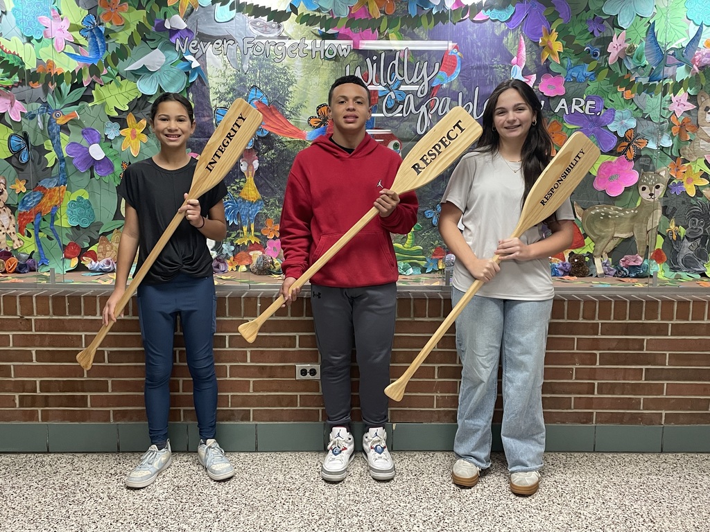 TMS Crew of the Week holding the oars.