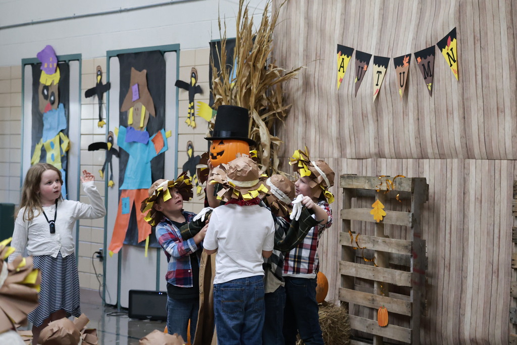 Broadway first graders build a scarecrow during their fall play.