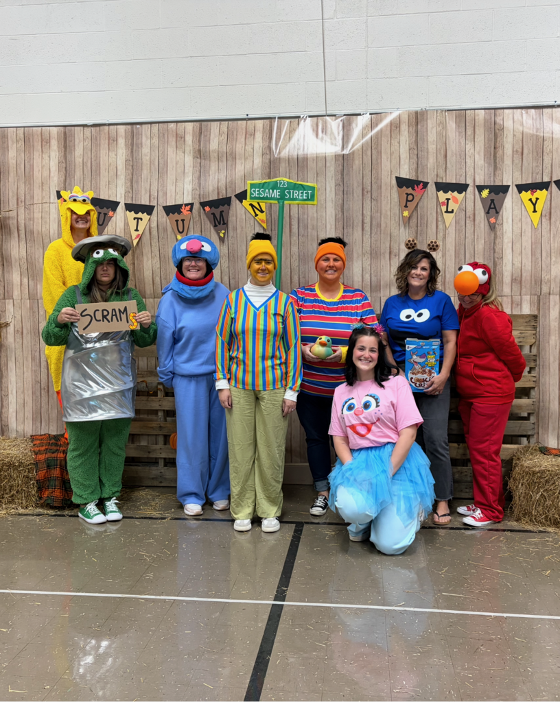 Staff dressed as Sesame Street.