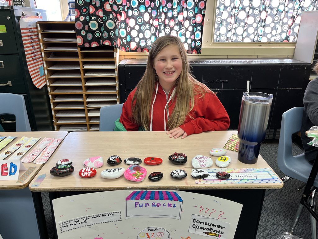 Student sells her fun rocks for an economics unit.