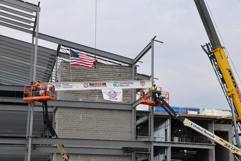 The beam gets moved into place.