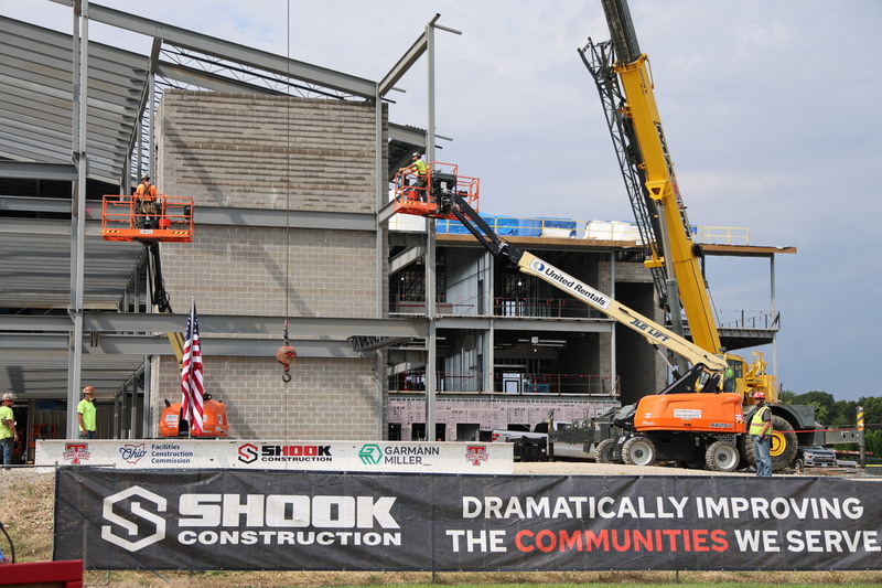 Crews get ready to lift the beam into place.