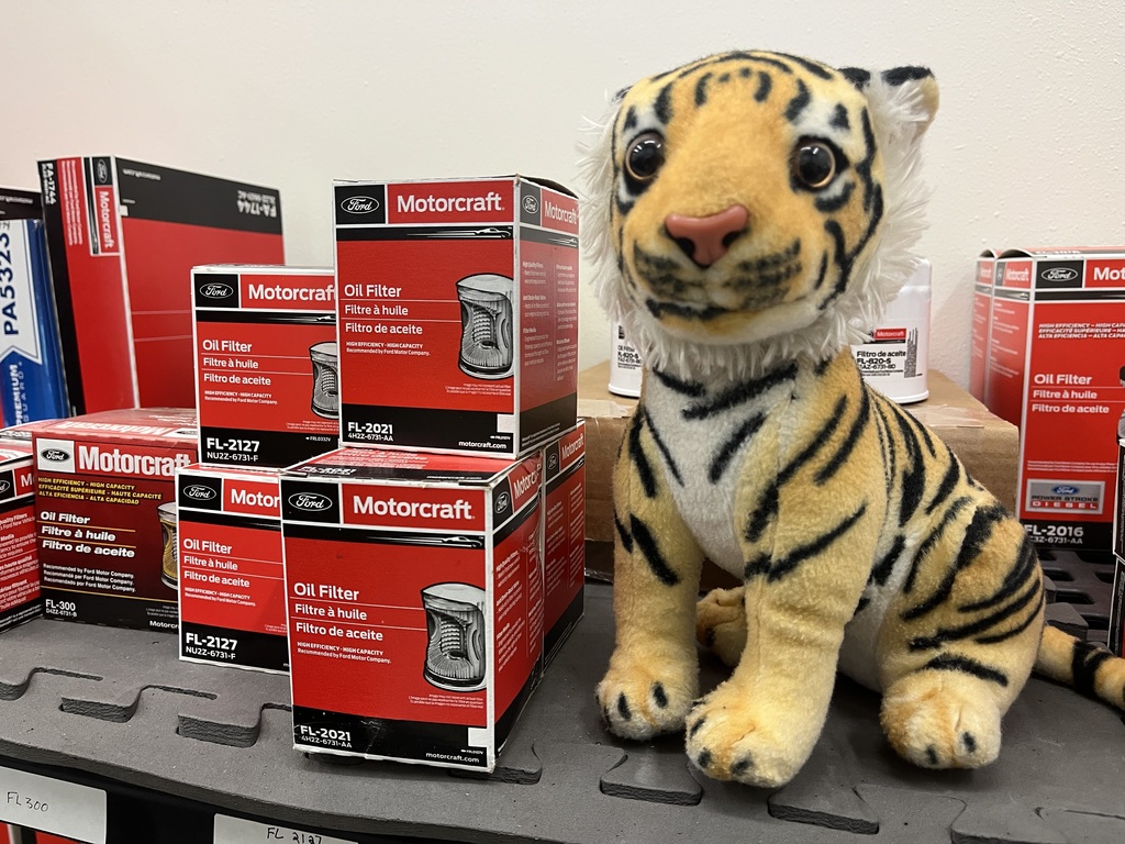 Tank with new car parts at dealership