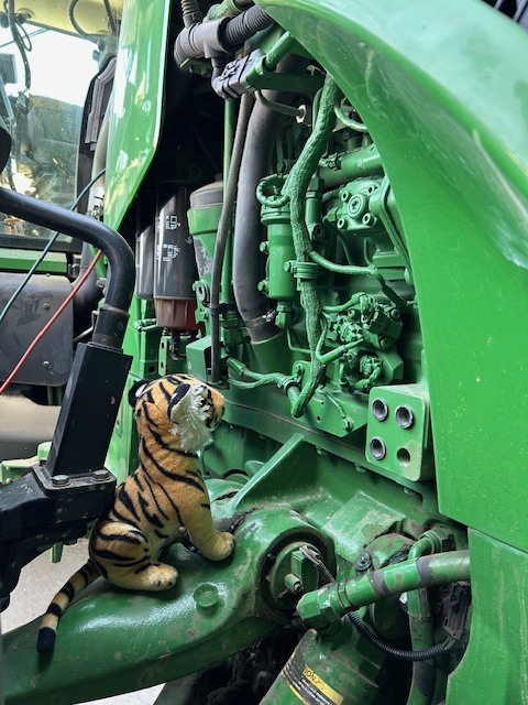 Tank inspecting a tractor