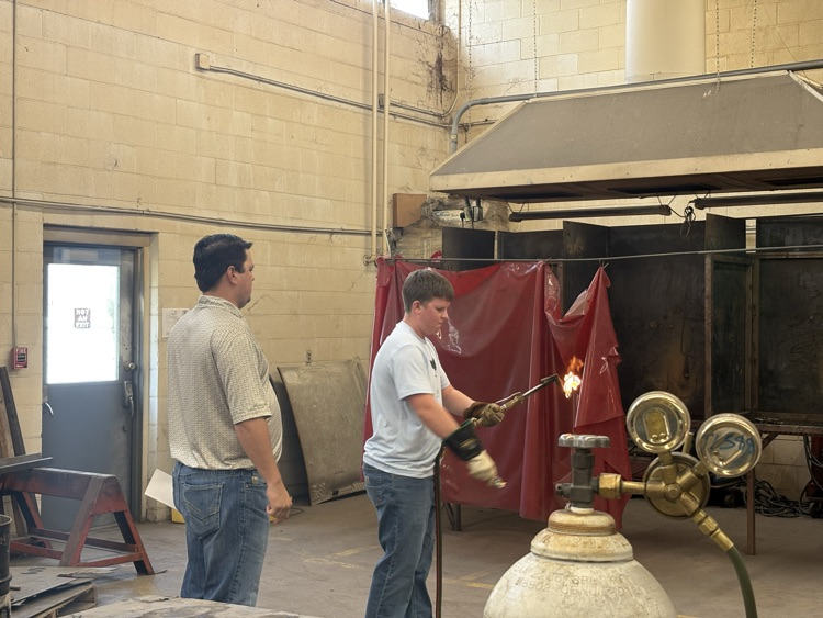 Students practicing lighting a torch in Welding II class