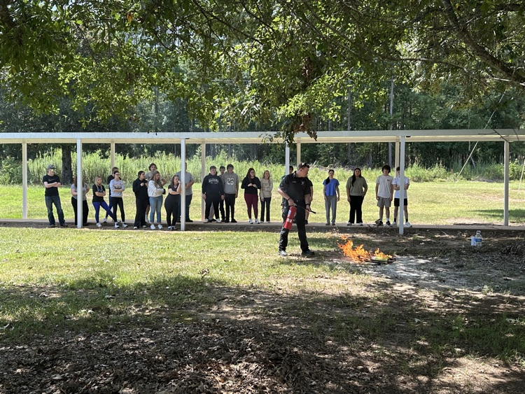 Lt. Jesse Gwin demonstrated fire extinguisher procedures.