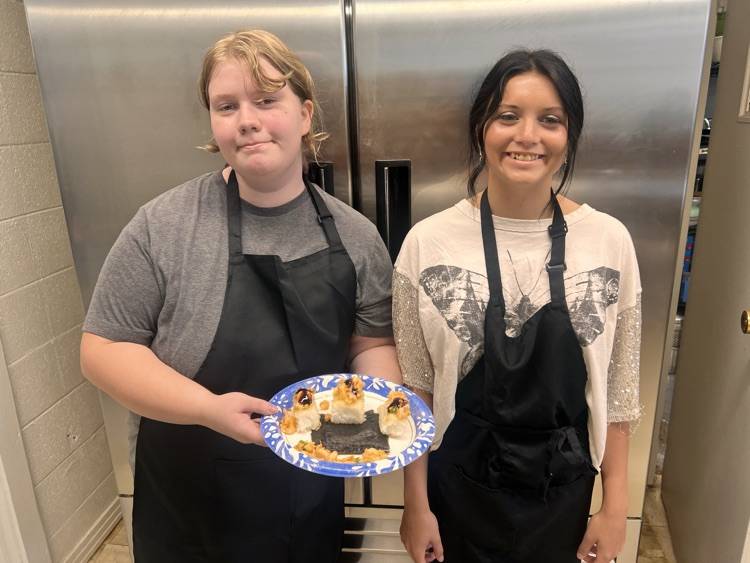 Students with their culinary dishes.