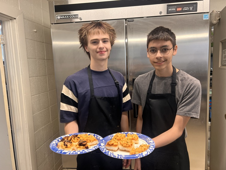 Students with their culinary dishes.