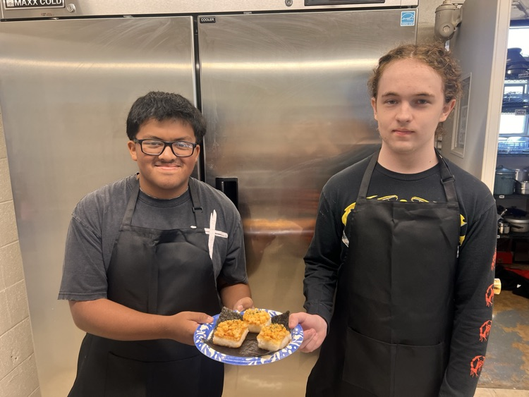 Students with their culinary dishes.
