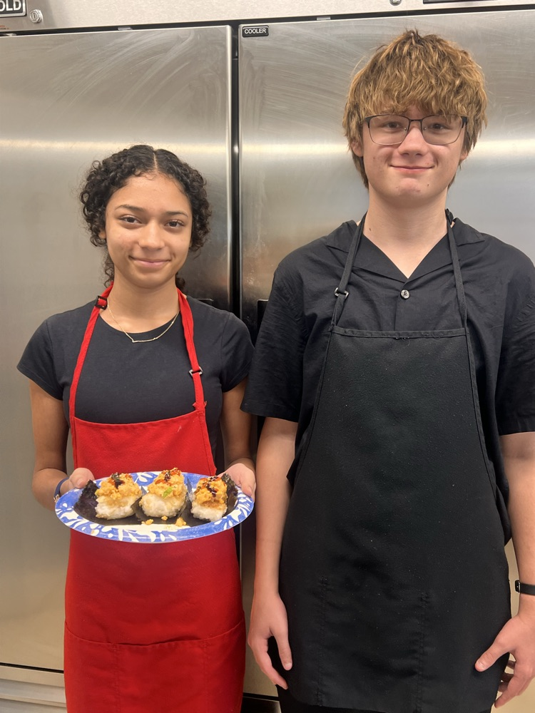 Students with their culinary dishes.