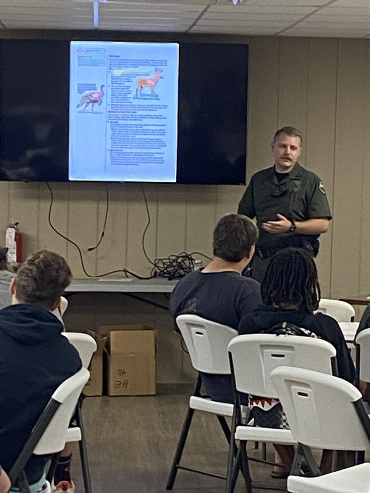 Game Warden Lane Young leading a safety course